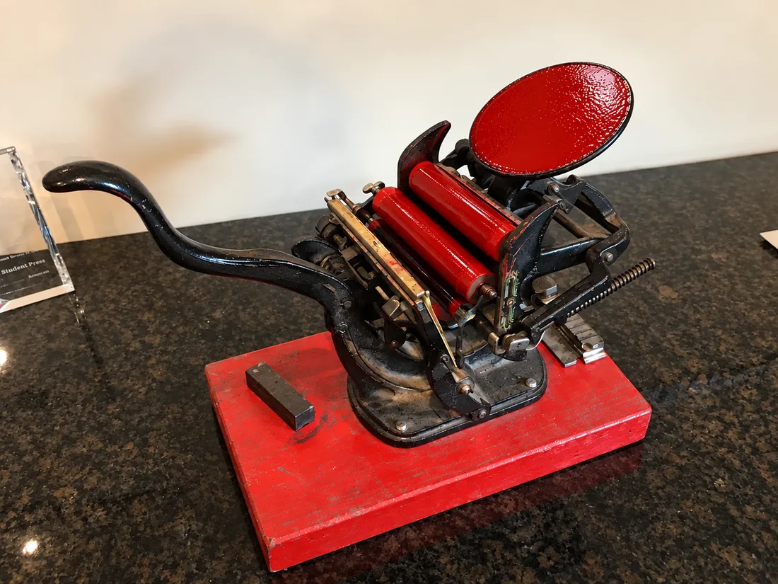 The Standard Press's first printing press, a small hand-lever press with red rollers