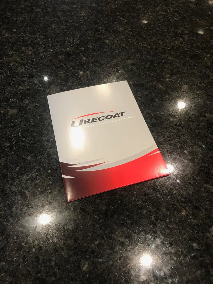 Durecoat presentation folder printed in full colour with a red swoosh and silver ink