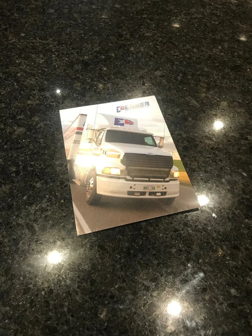 Denner presentation folder with a semi-truck photo on the cover