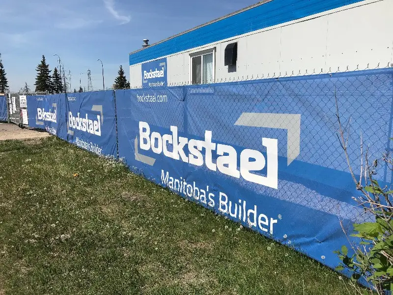 Printed fence mesh along a construction site