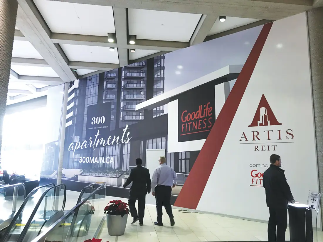 A large printed wall graphic in an office lobby